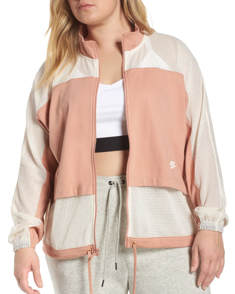 Front of a model wearing a size 1X Nike Women's Plus Sportswear Mesh Jacket Pink Size 1X in Pink by Nike. | dia_product_style_image_id:314551